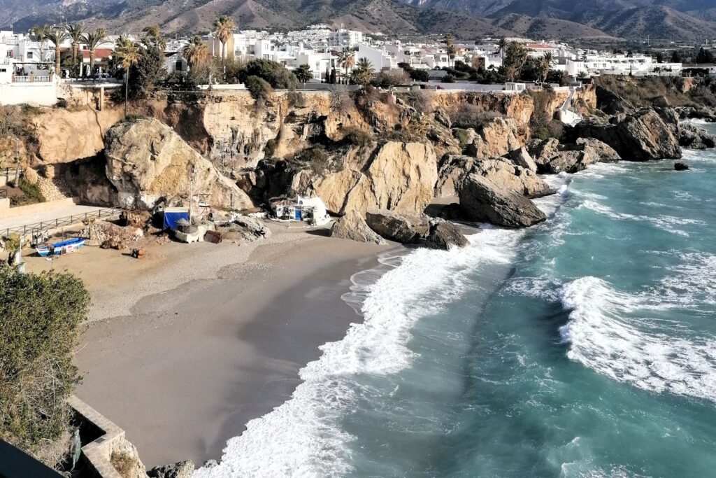 how-to-travel-on-a-budget-spain-beach